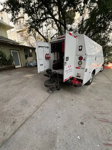 Magnet Plumbing service vehicle on-site for Grease Trap Cleaning in Sunset Gardens
